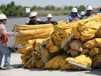 BP, Workers work to clean up oil spill in Gulf of Mexico