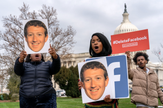 Facebook protesters with Delete Facebook and Mark Zuckerberg signs, Washington DC