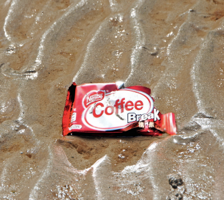 Nestle wrapper at the beach