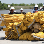 BP, Workers work to clean up oil spill in Gulf of Mexico